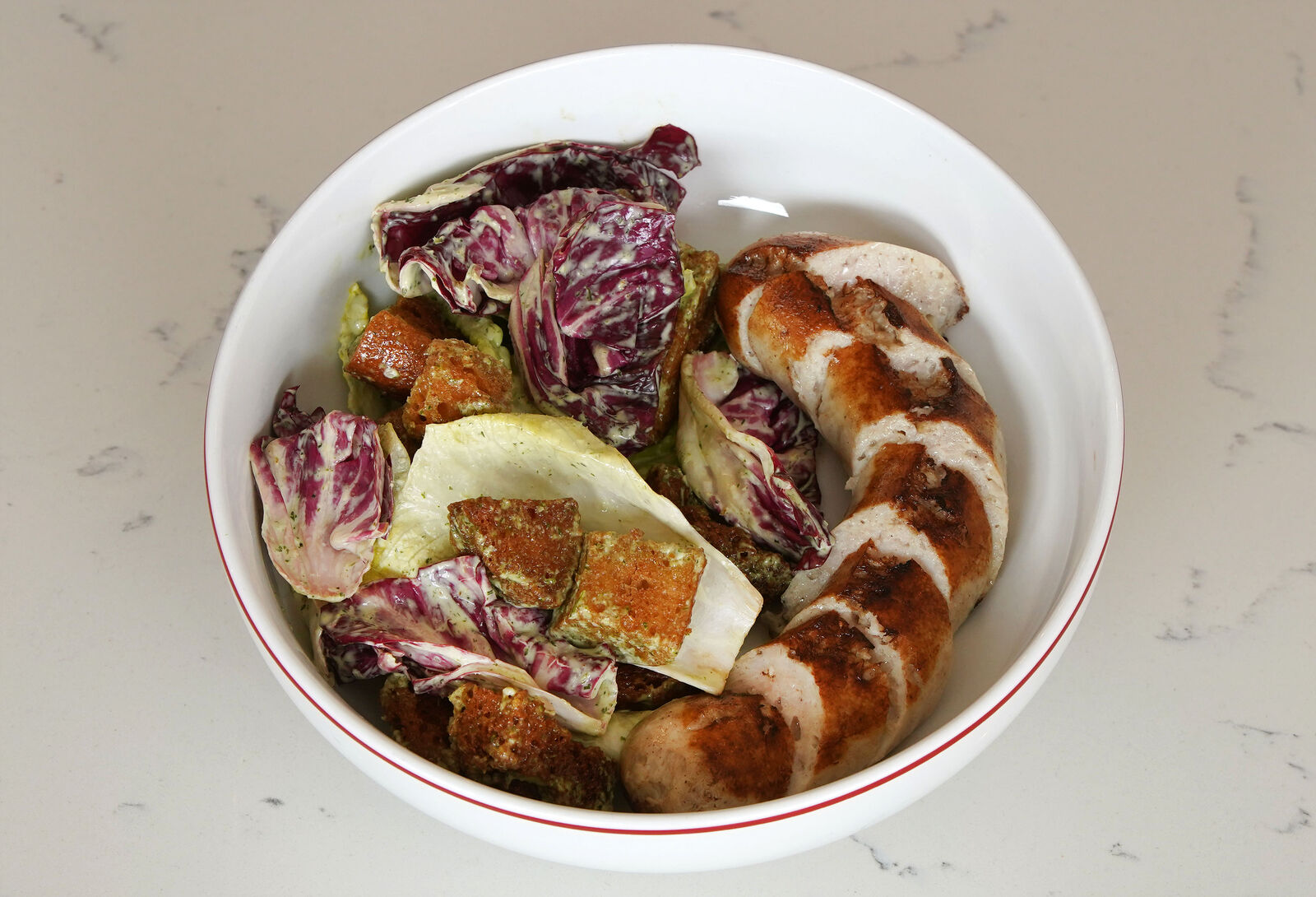 Boudin blanc sausage with panzanella salad at Café Bar Moriarty